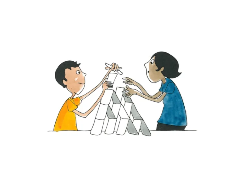 Two learners building a tower together